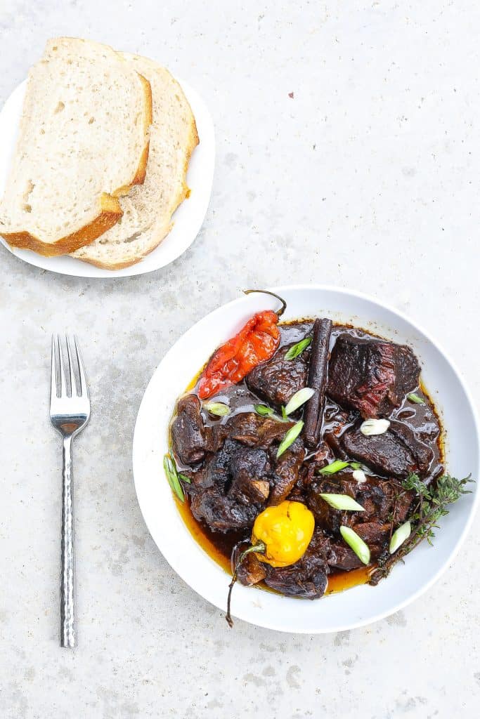 stewed beef pepperpot in white bowl