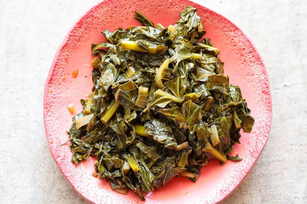 collard greens on a pink plate