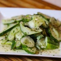 cucumber salad on a white plate