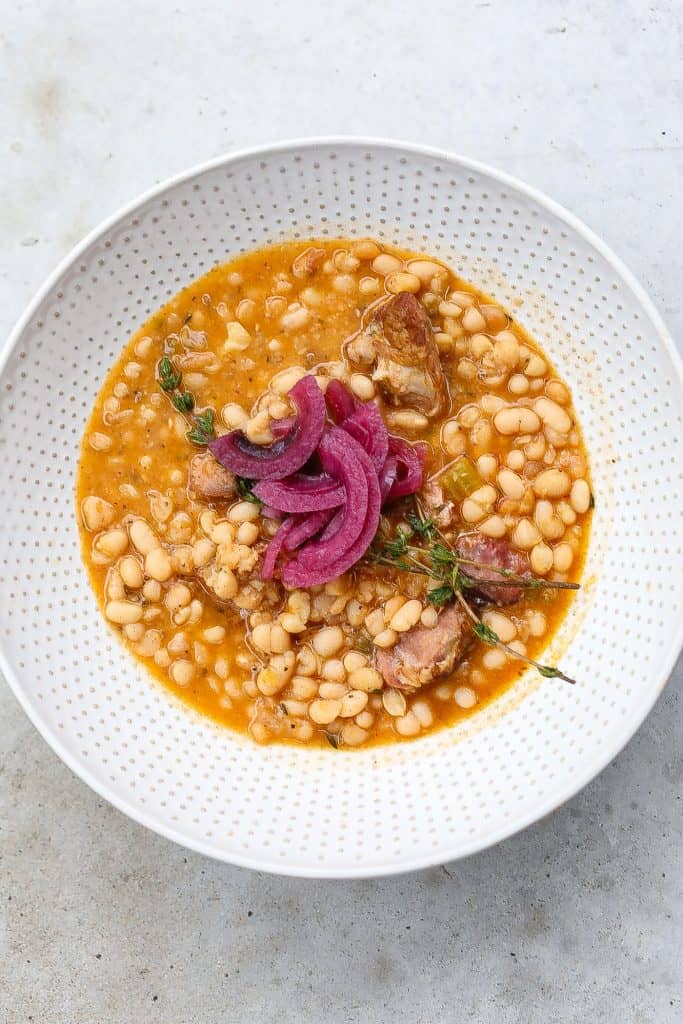 navy beans and hame in white bowl