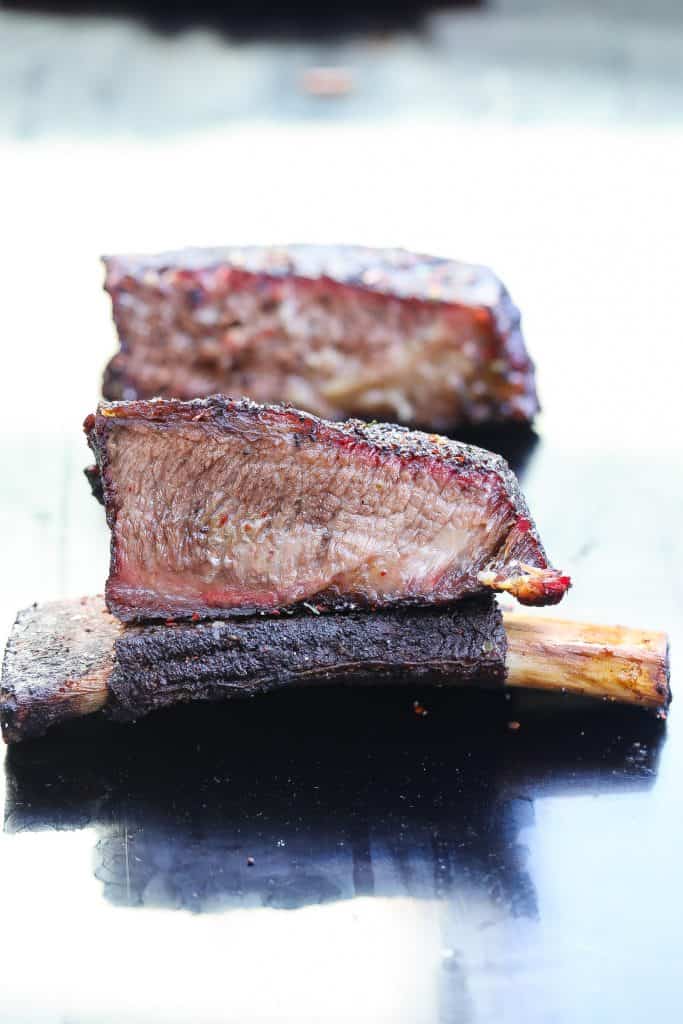 smoked beef ribs on black plate