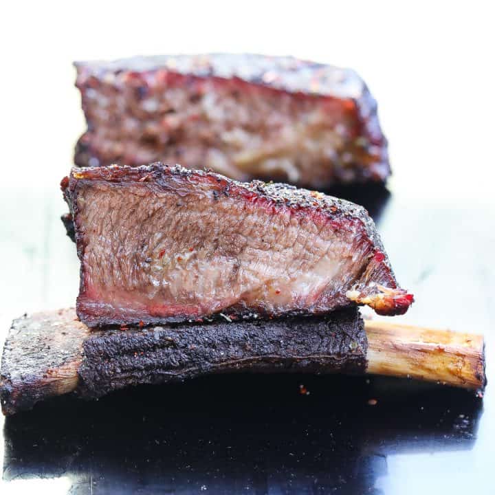 smoked beef ribs on black plate