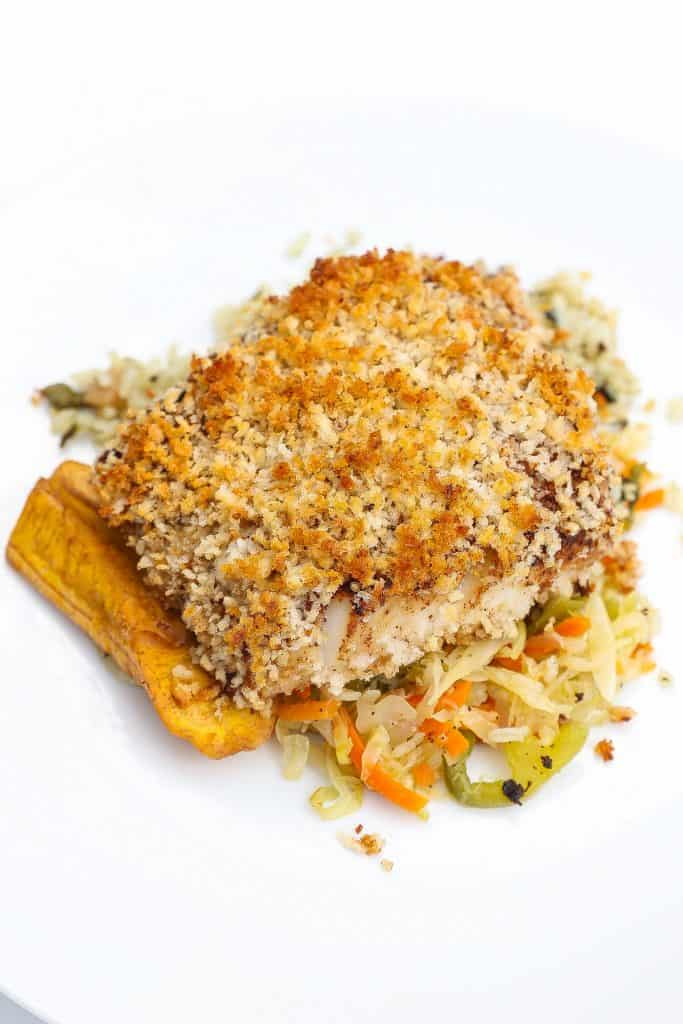 cod with panko crust on top of cabbage and plantains