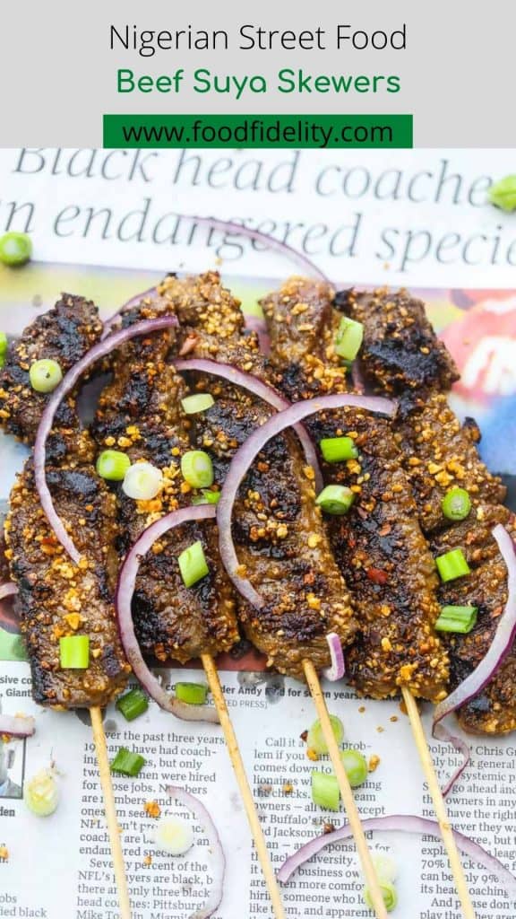 beef skewers on newspaper