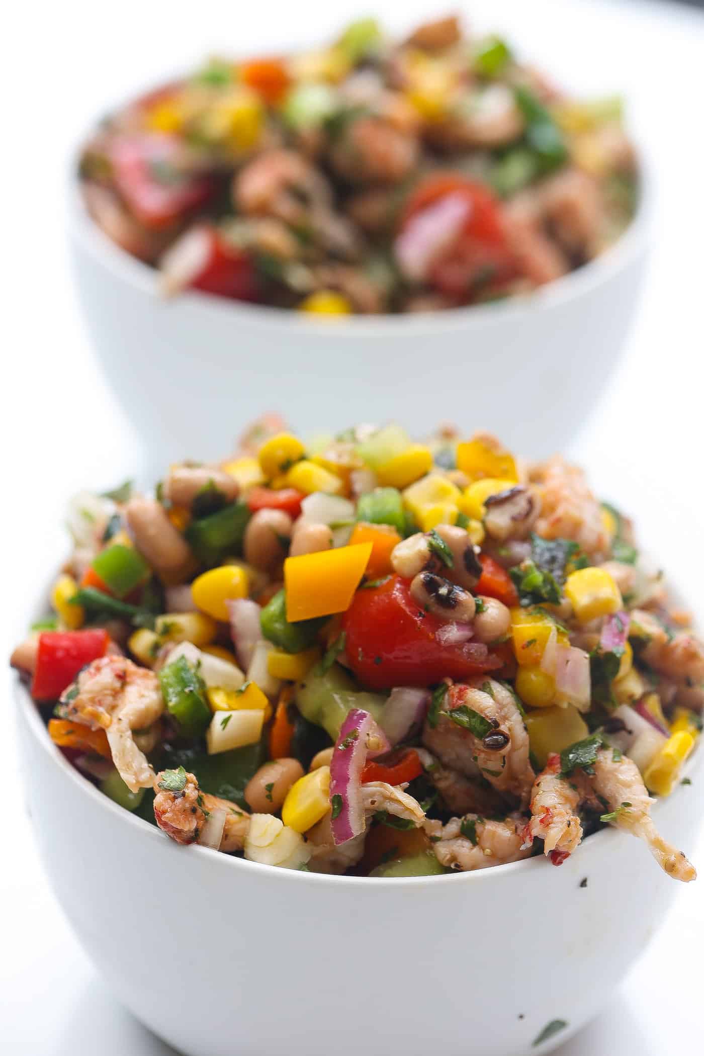 black eyed pea salad in dual white bowls