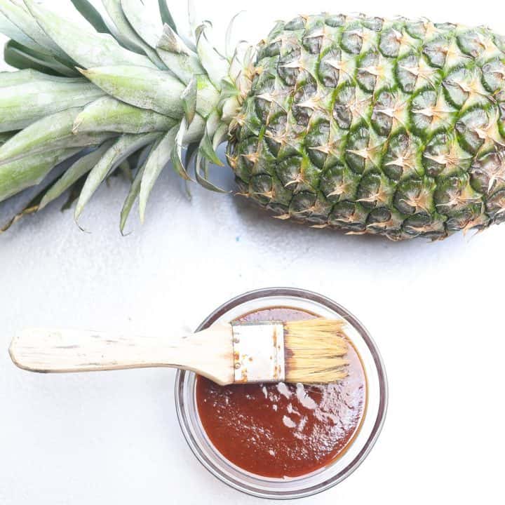 pineapple bbq sauce in a glass bowl with brush