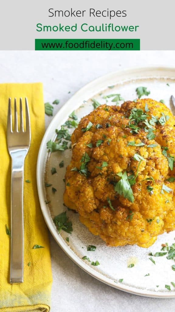 whole smoked cauliflower on a plate