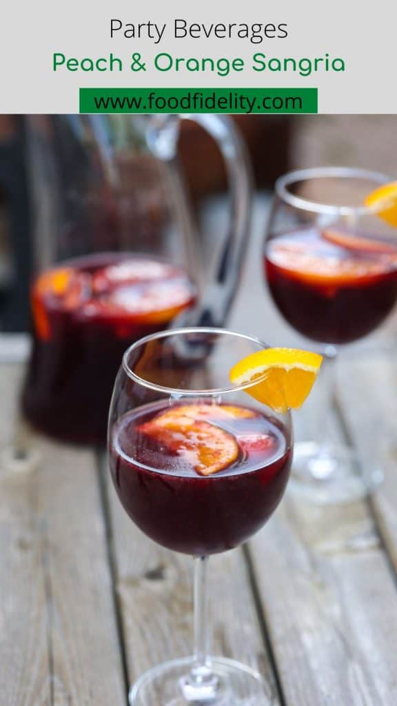 red wine sangria in glasses with orange and peach slices