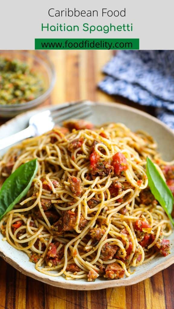 spaghetti and sausage cubes on a plate