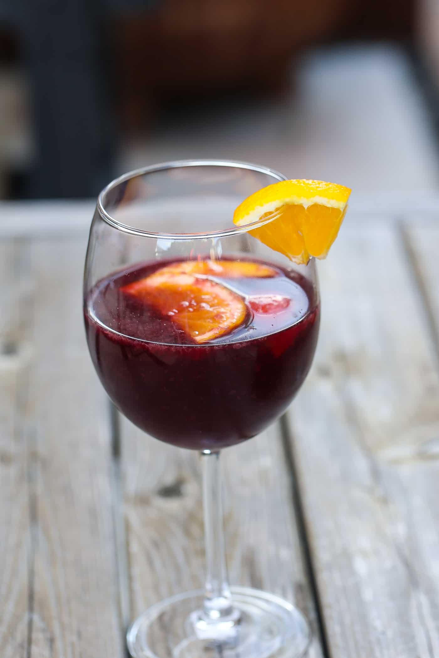 red wine sangria in glasses with orange and peach slices