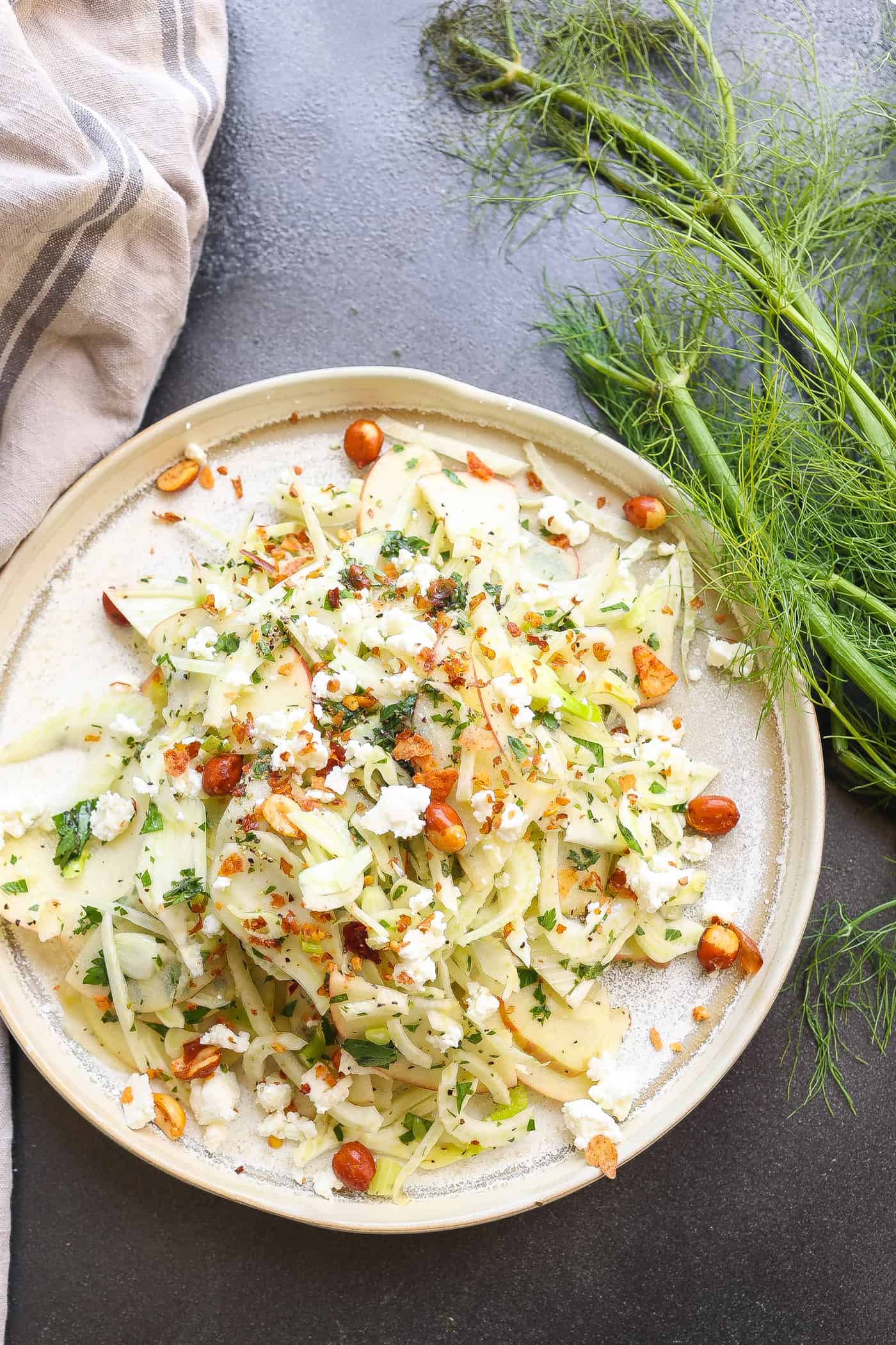 fennel and apple salad on a tan plate