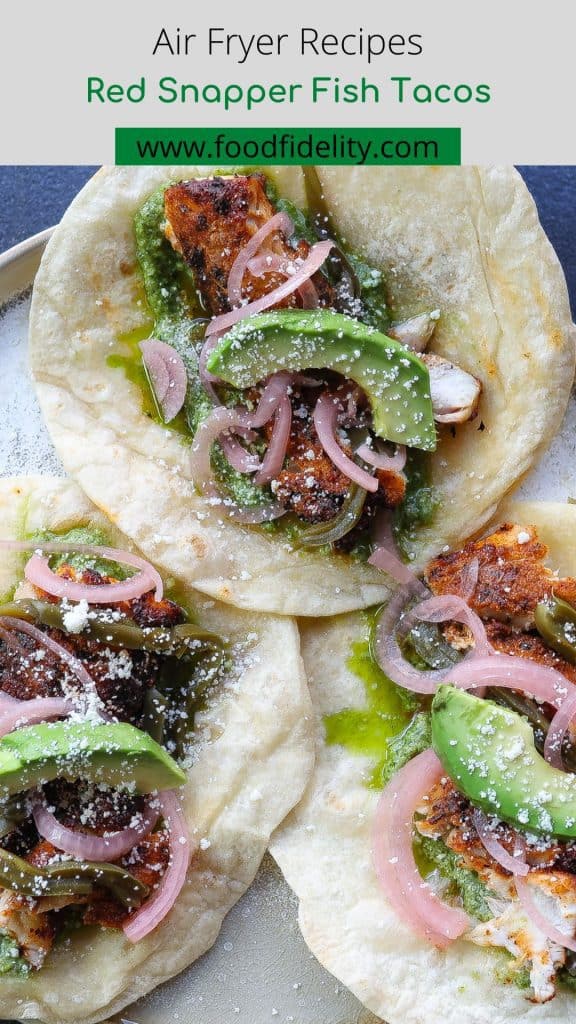 three fish tacos on a tan plate.