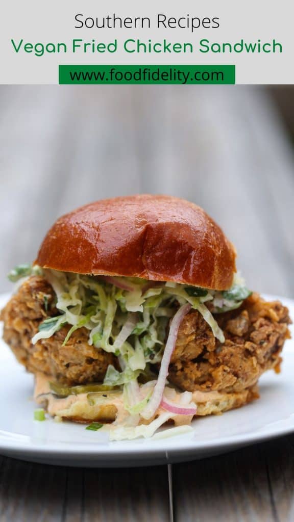 vegan fried chicken sandwich with slaw on a white plate