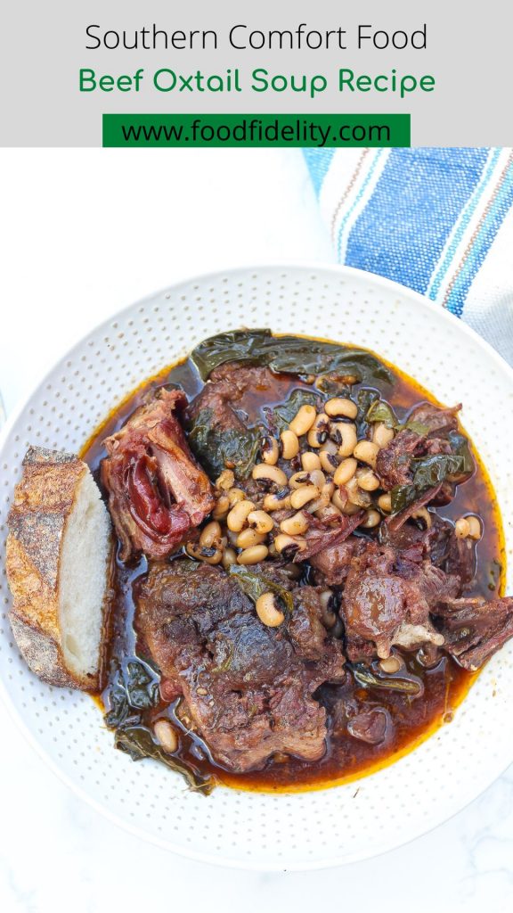 beef oxtail soup with collard greens and blackeyed peas in a white bowl
