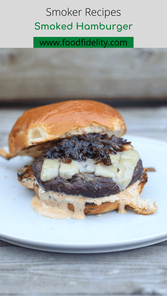 smoked burger with melted cheese, sauce, and caramelized onions