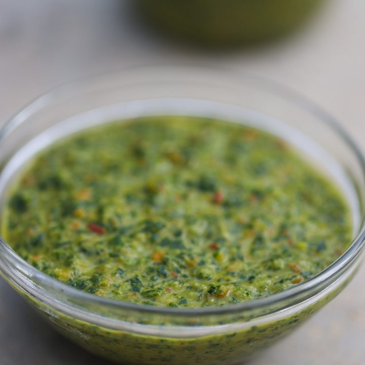 green seasoning base mix in a clear glass bowl