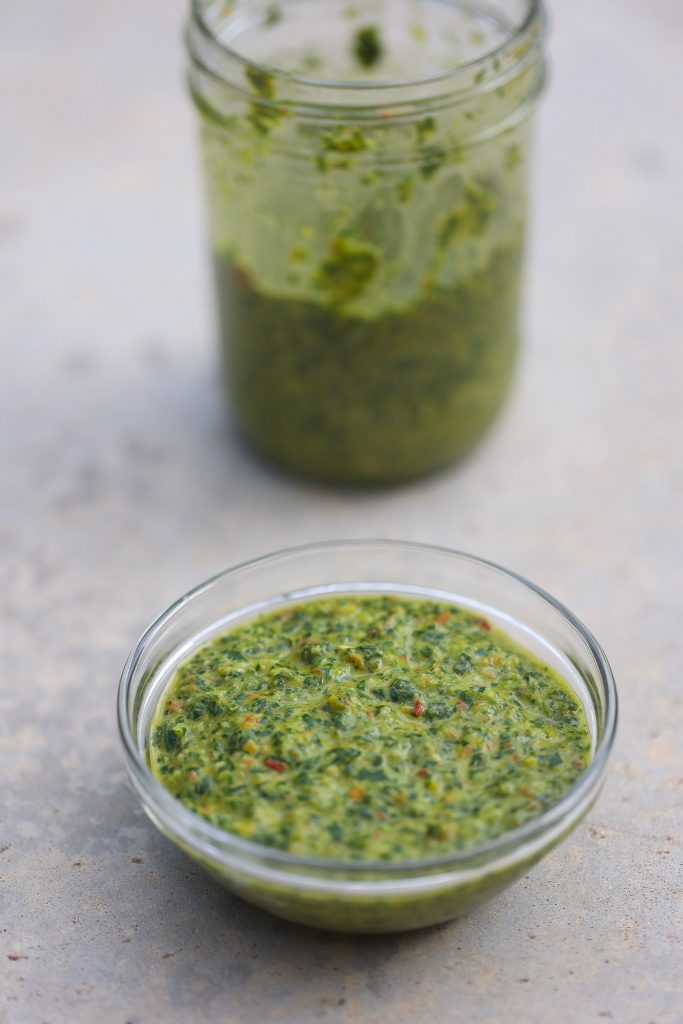 green seasoning base mix in a clear glass bowl