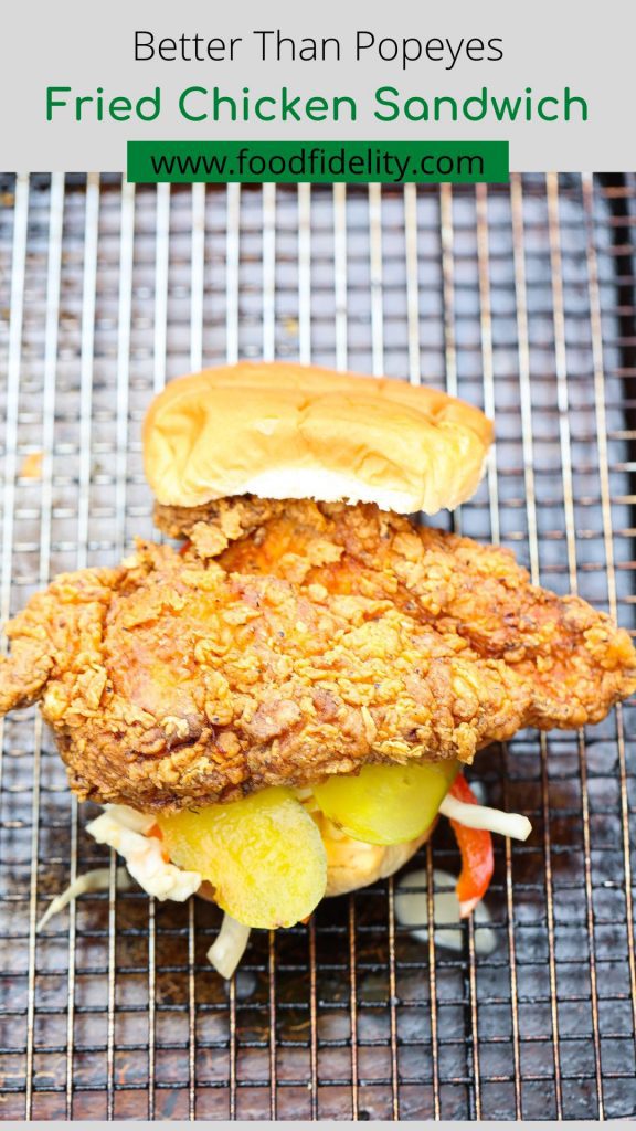 fried chicken sandwich on wire rack lined baking sheet