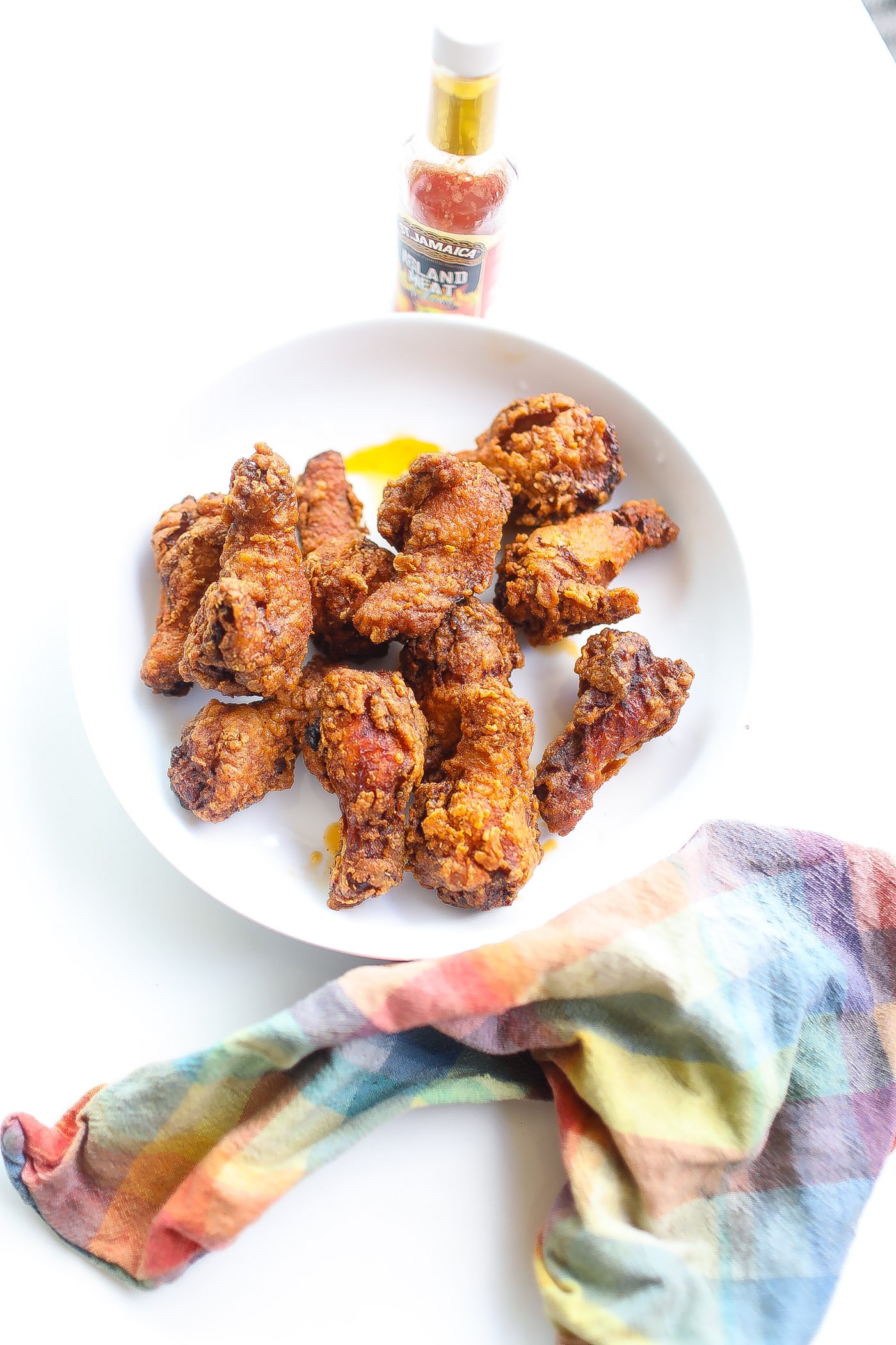 fried chciekn drumettes in a white bowl