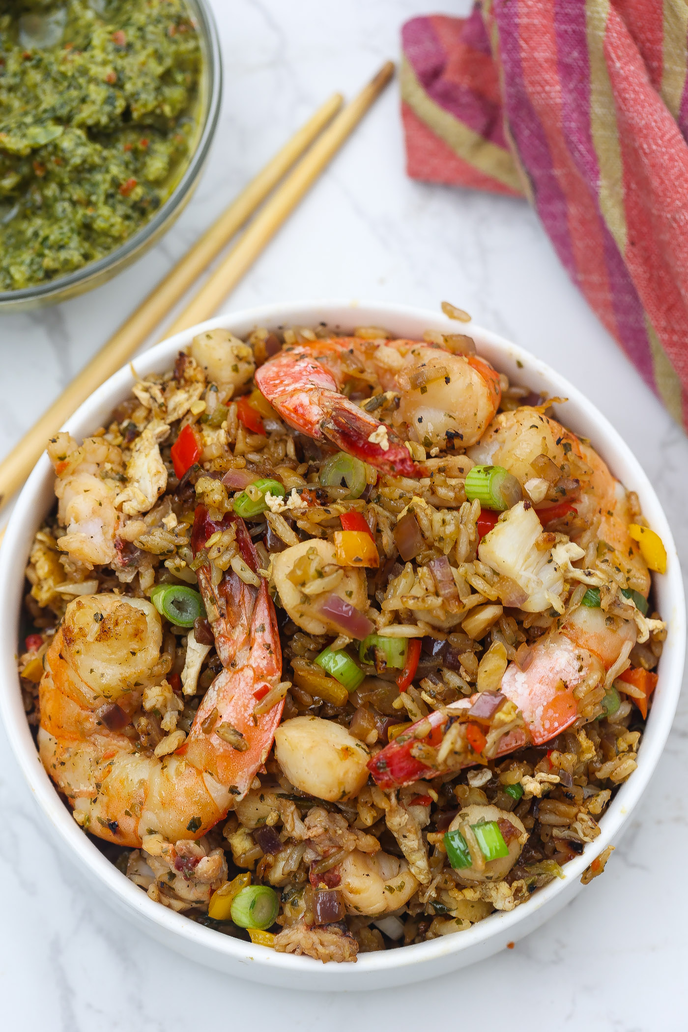 seafood fried rice with shrimp on a white plate