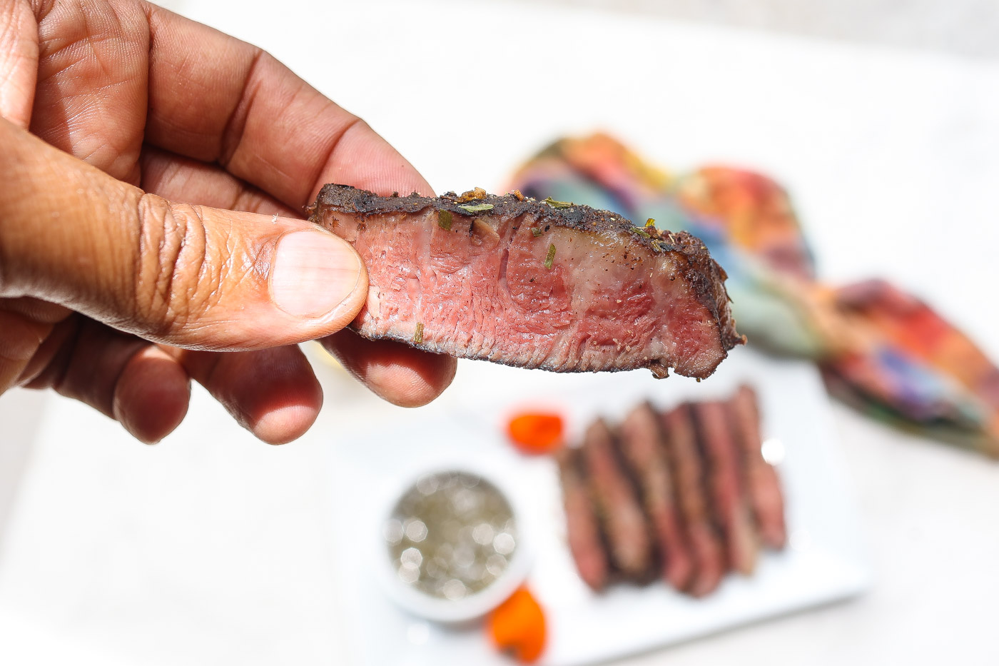 tender slices of sous vide chuck steak on white plate