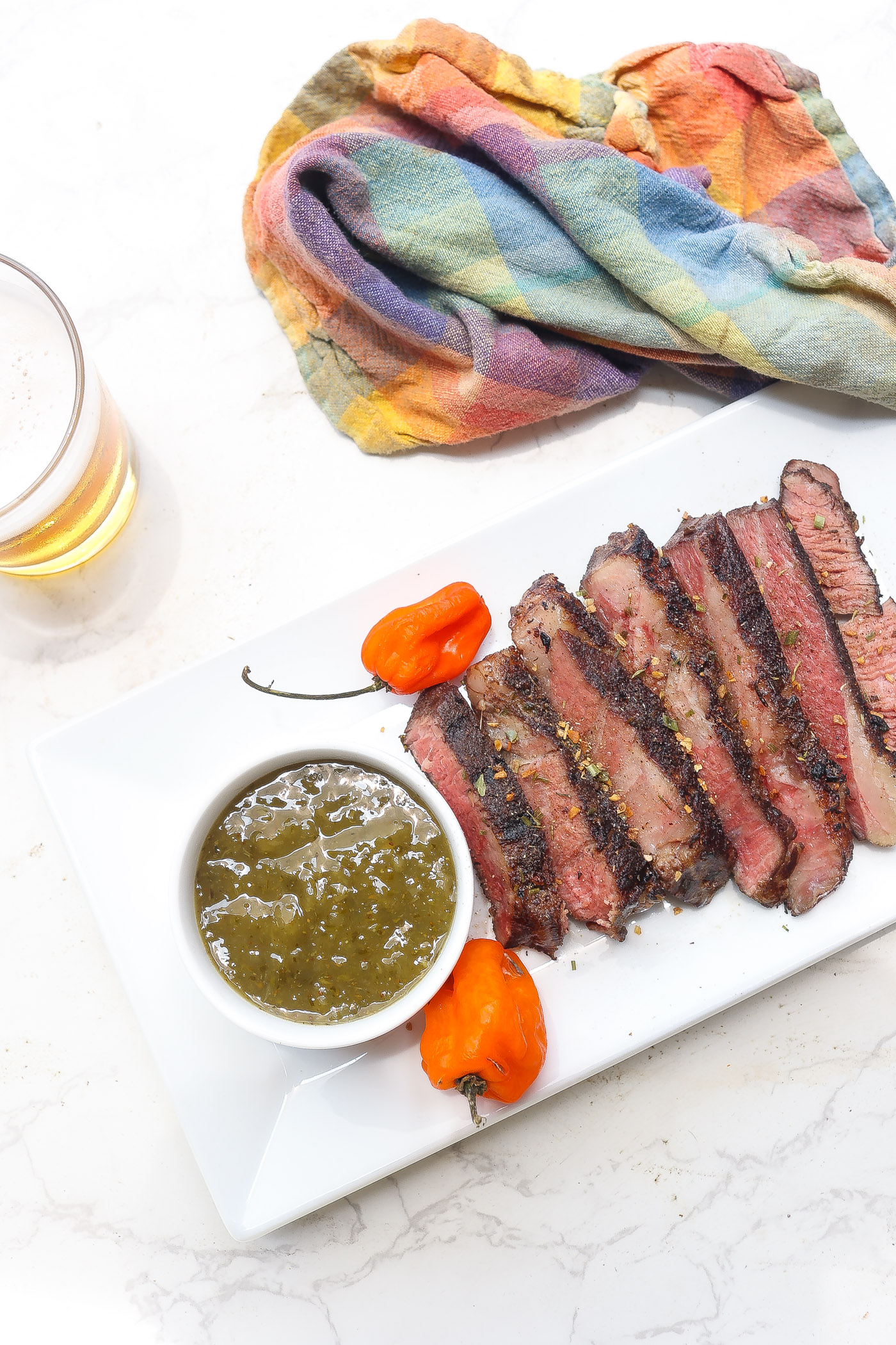 tender slices of sous vide chuck steak on white plate