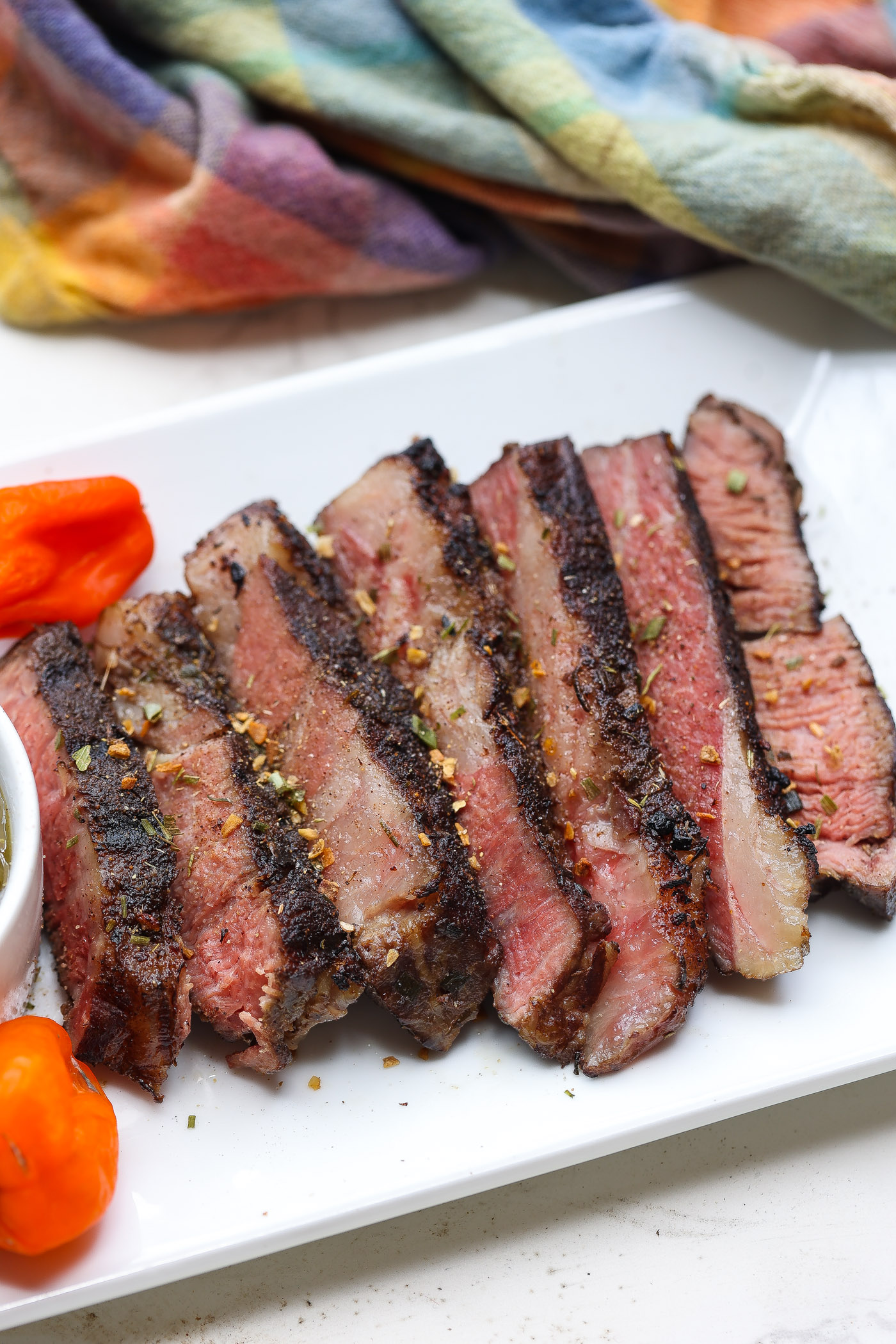 tender slices of sous vide chuck steak on white plate