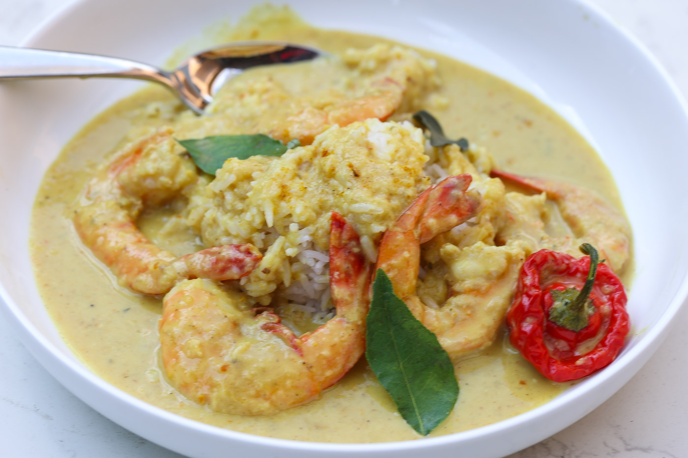 shrimp and rice in yellow peach curry sauce