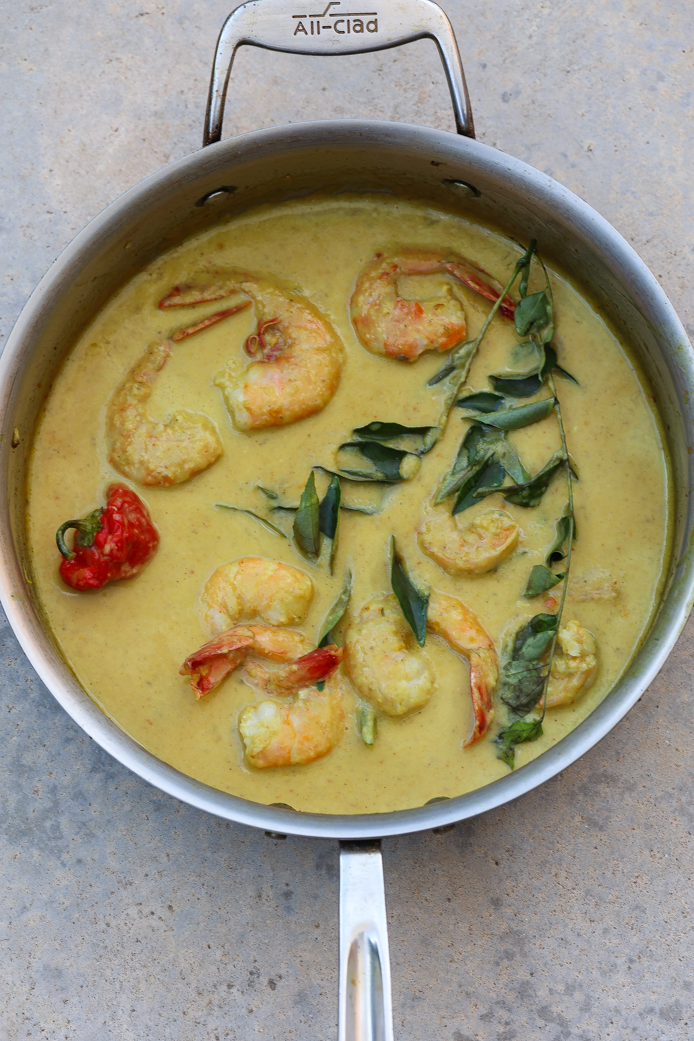 shrimp and rice in yellow peach curry sauce