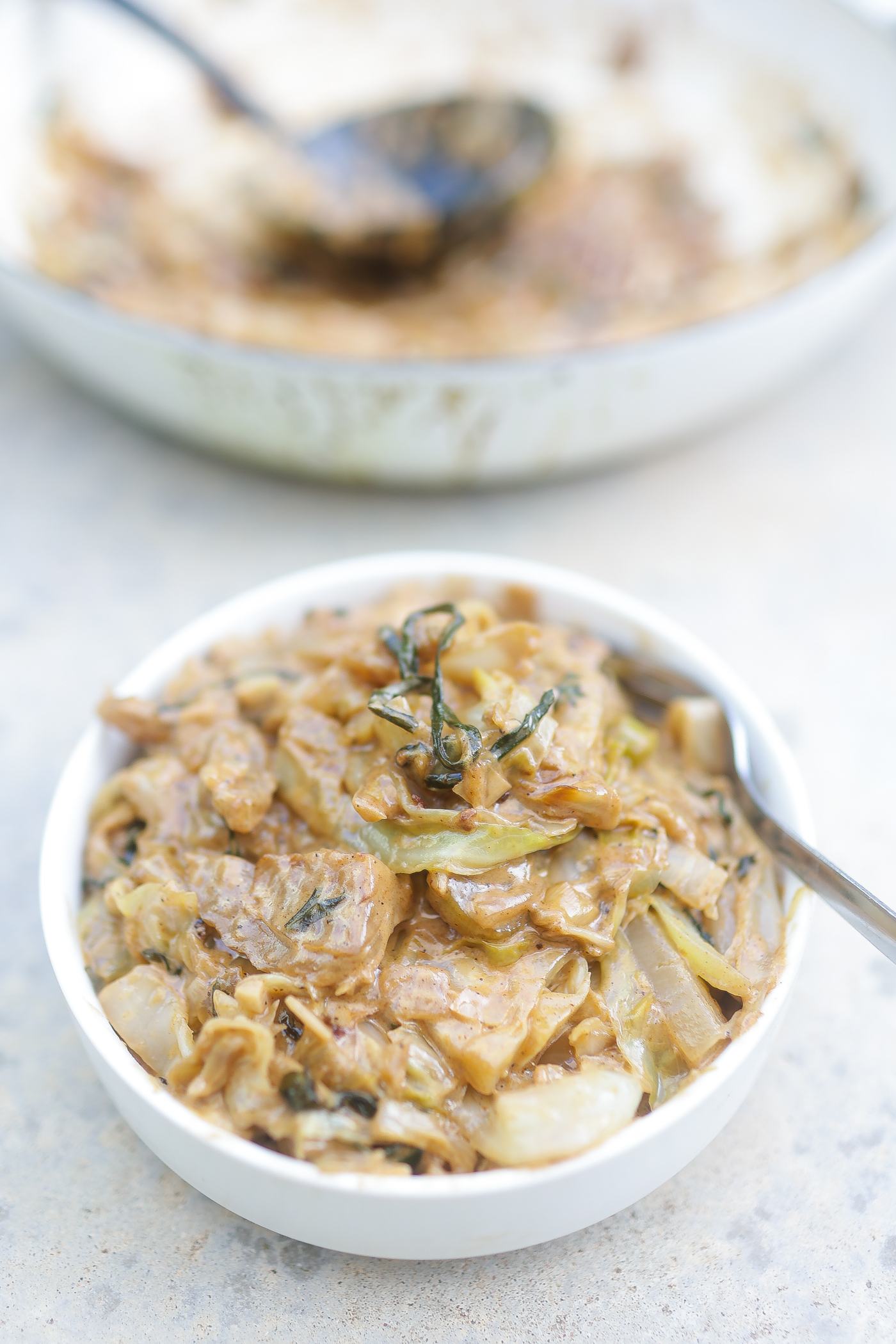 creamed cabbage in a white bowl