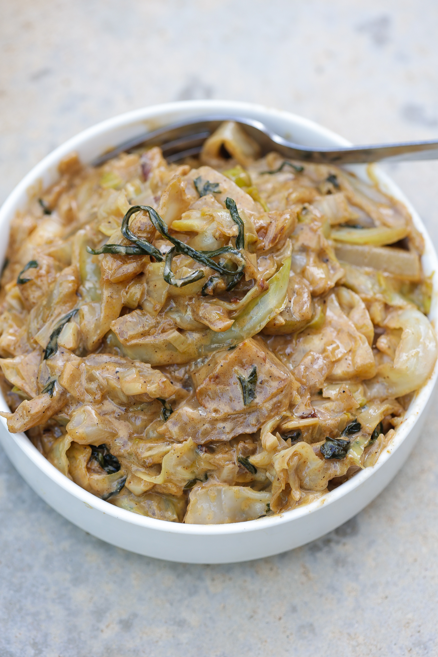 creamed cabbage in a white bowl