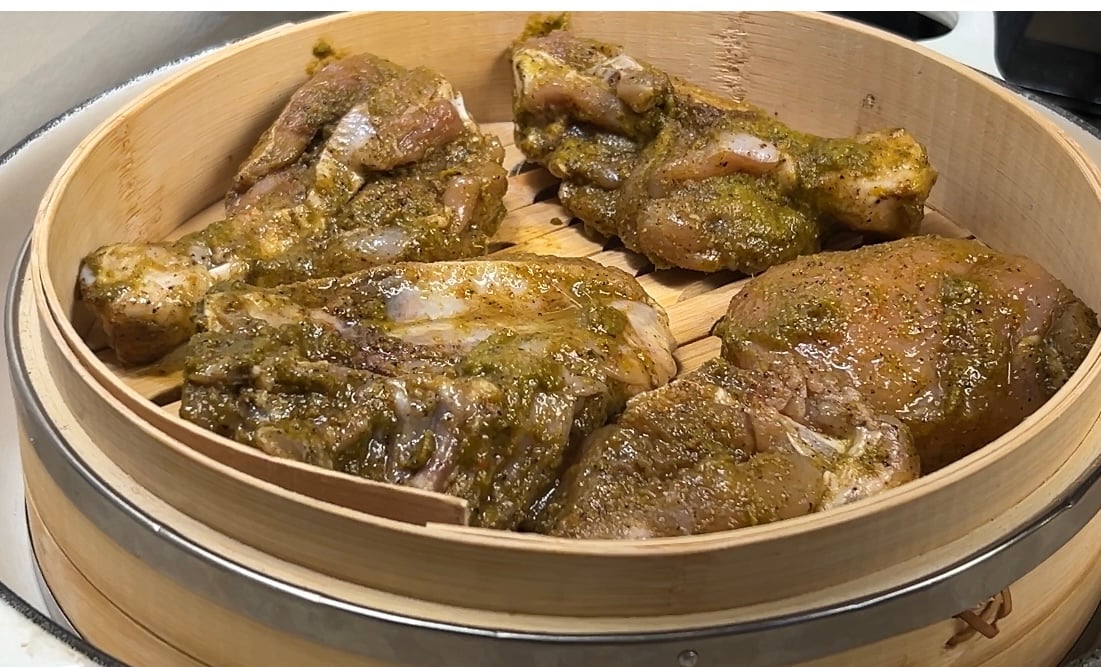 chicken steaming in japanese bamboo basket