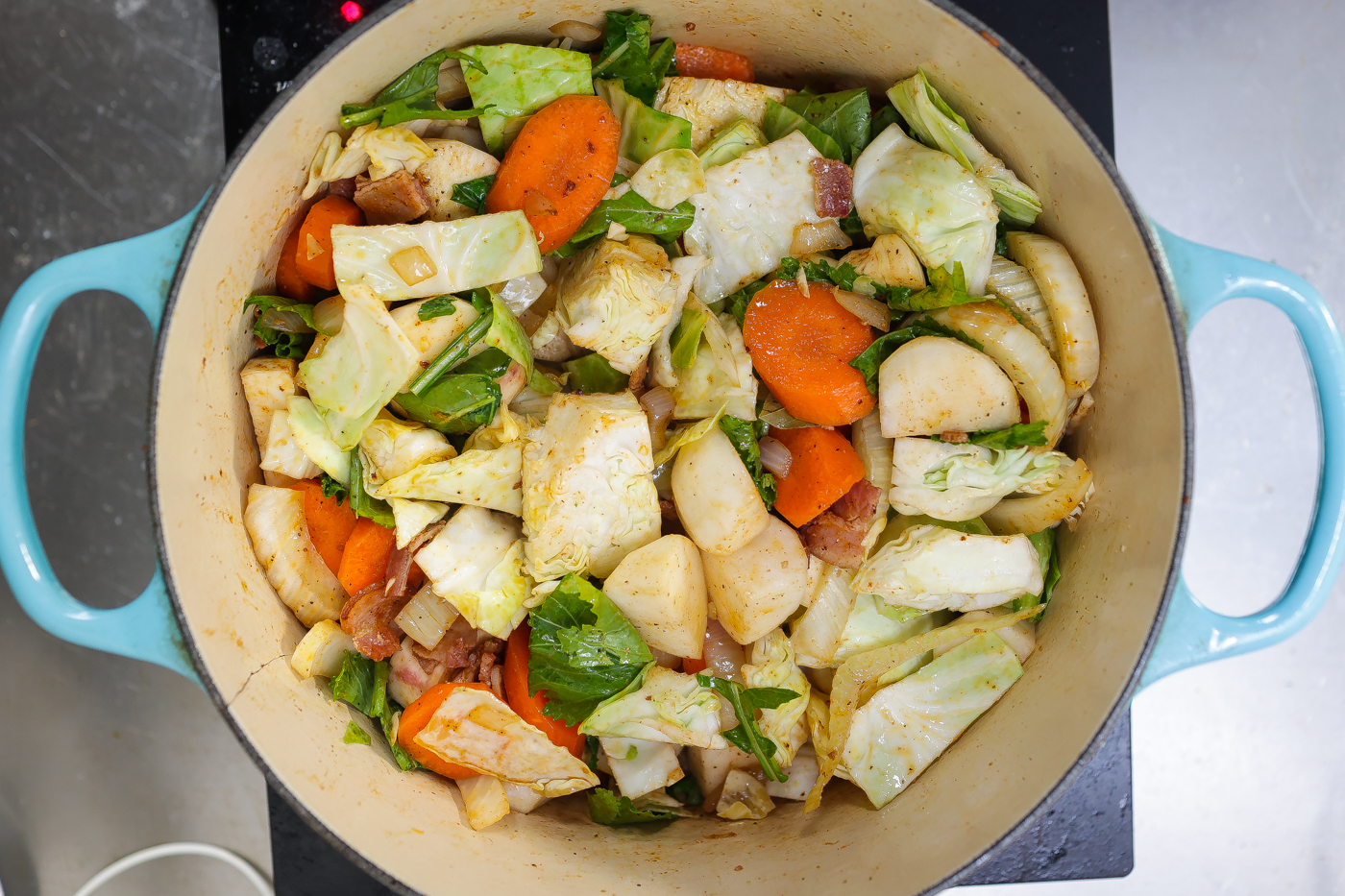 vegetables sauteing in a pot