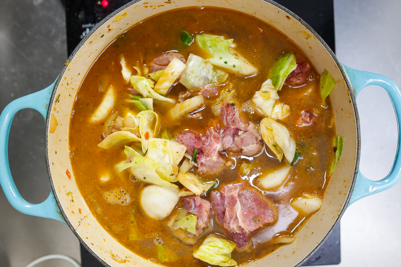 pork stew cooking in pot