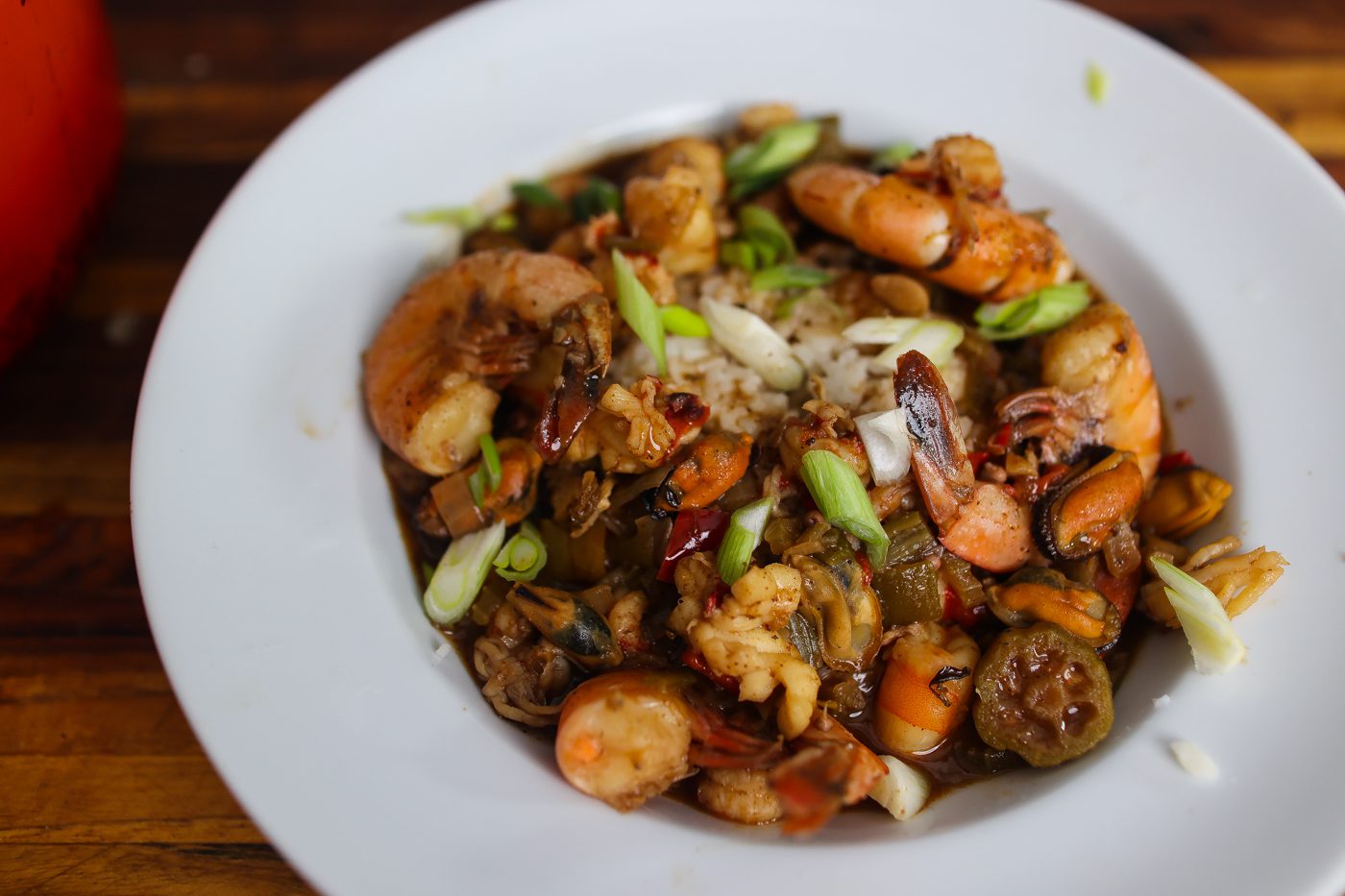 seafood gumbo in white bowl