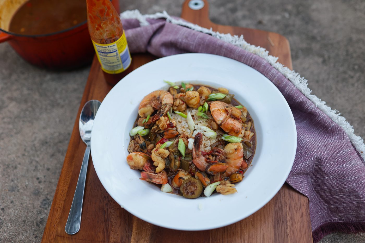 seafood gumbo in white bowl