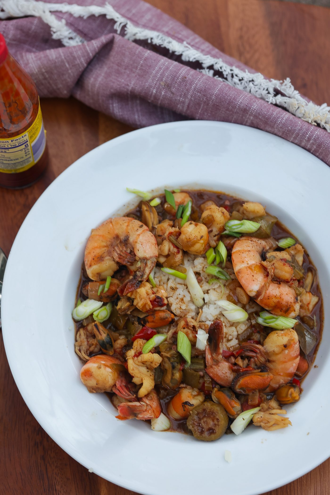 seafood gumbo in white bowl