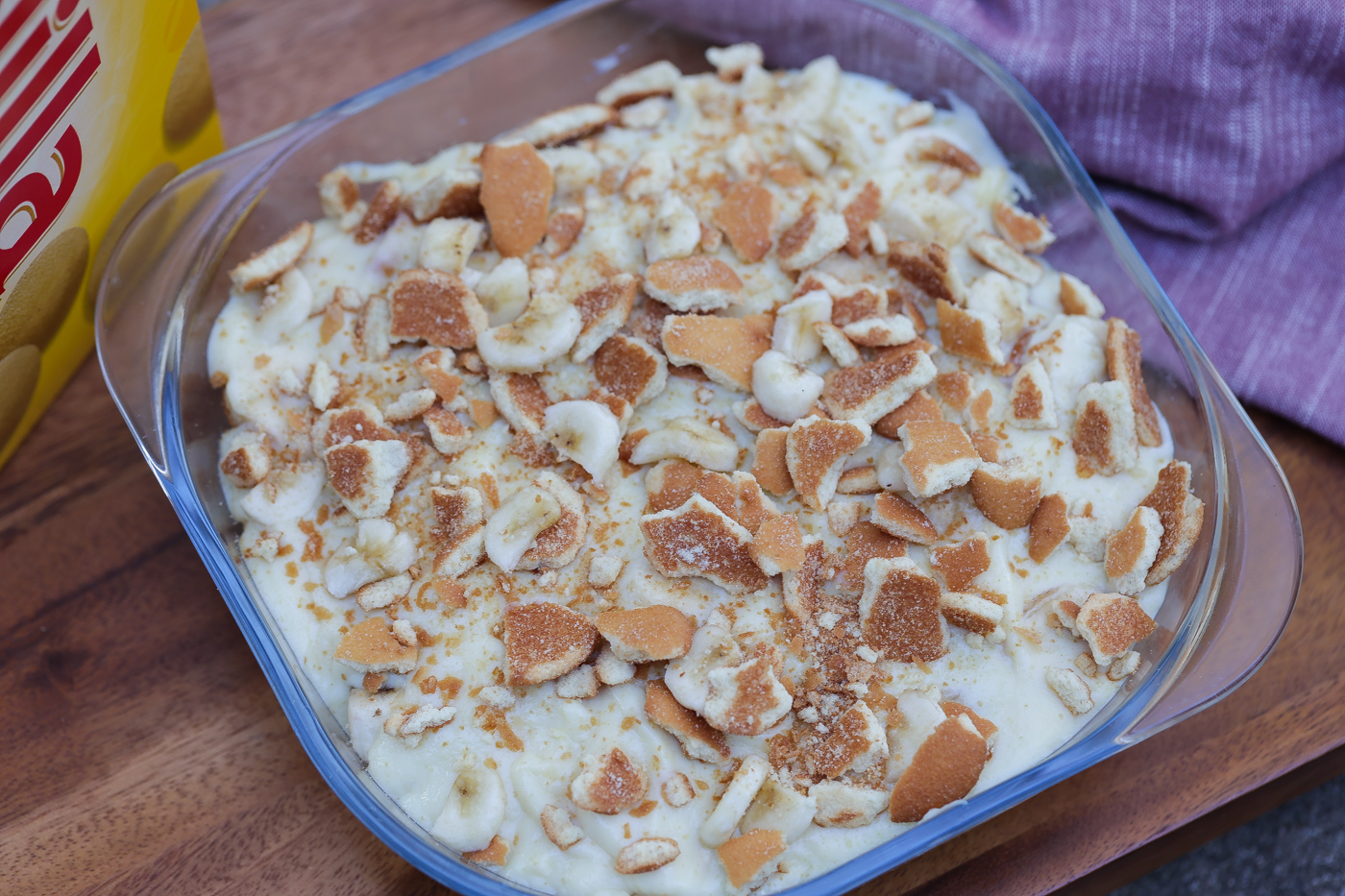 Old fashioned banana pudding layered in glass bowl