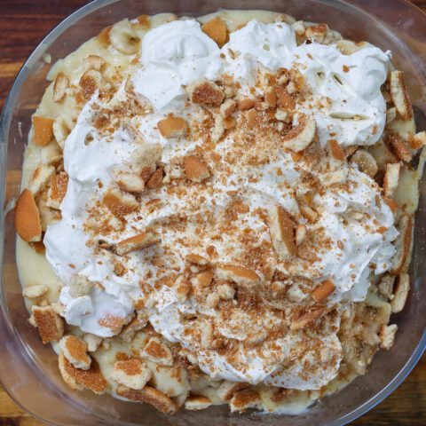 Old fashioned banana pudding layered in glass bowl