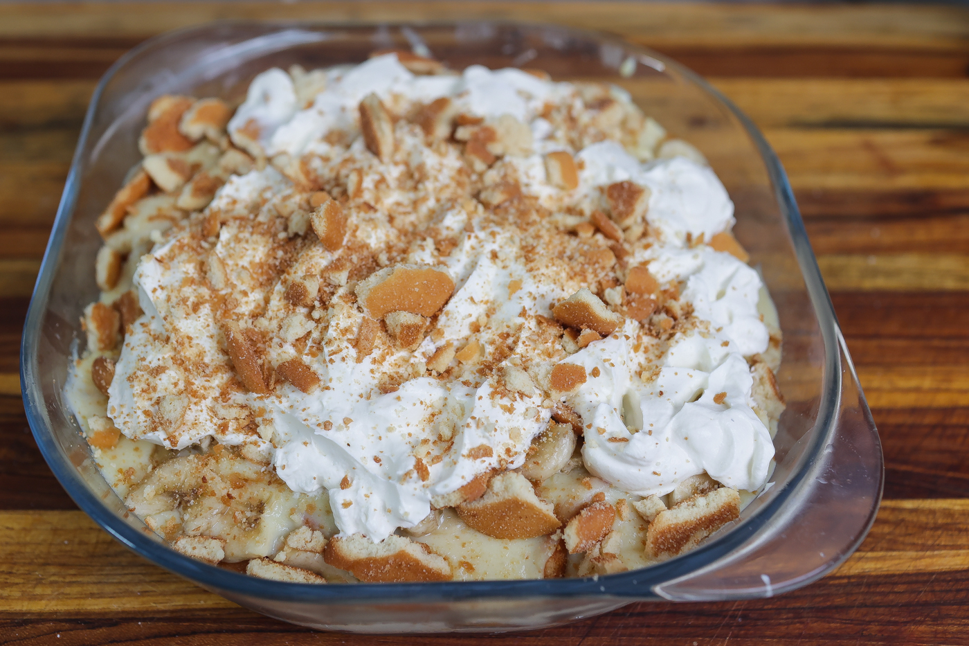 Old fashioned banana pudding layered in glass bowl