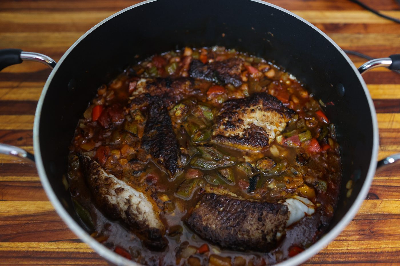 blackened catfish stew cooking in a pot