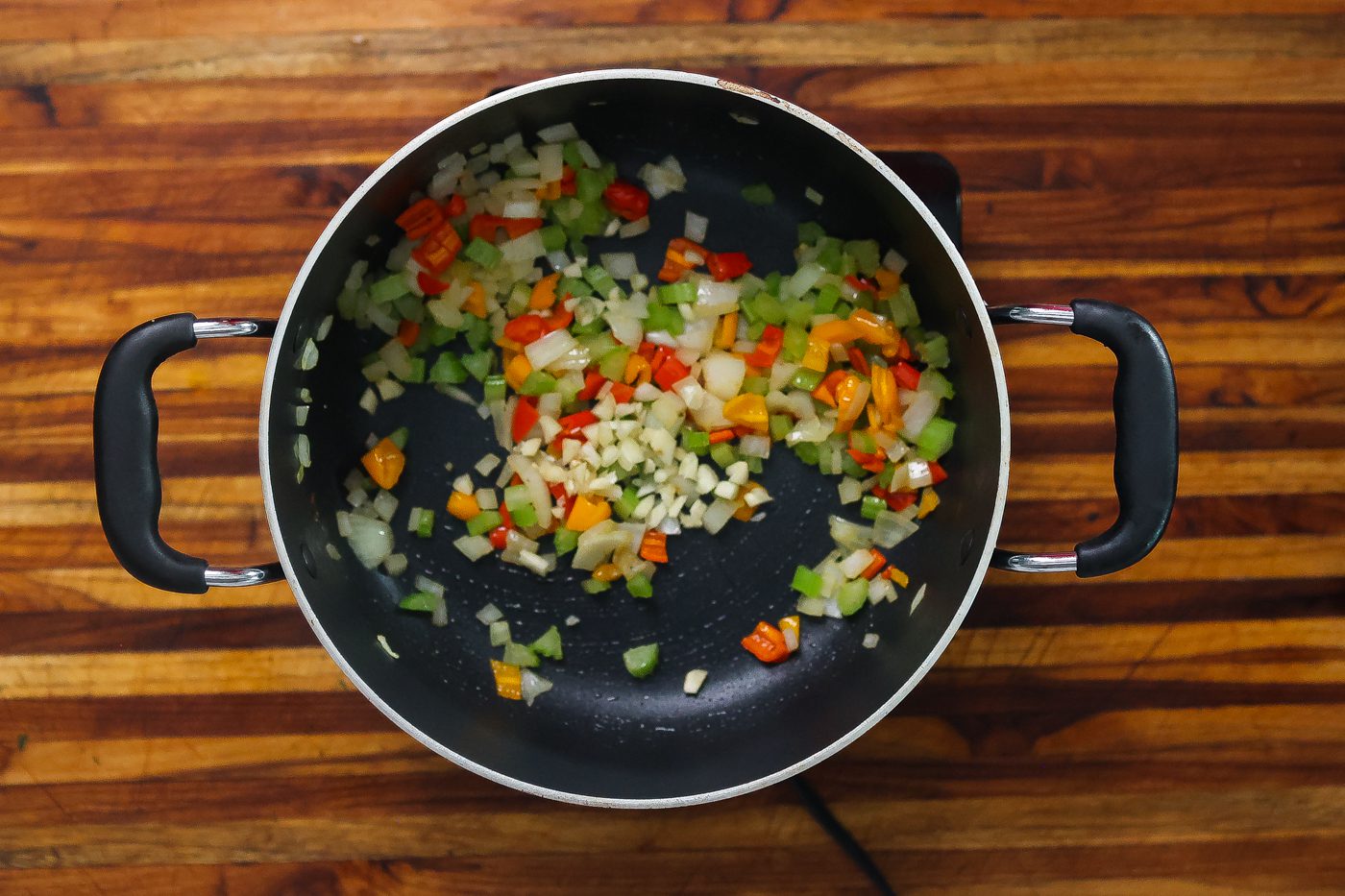 vegetables sauteing in pan