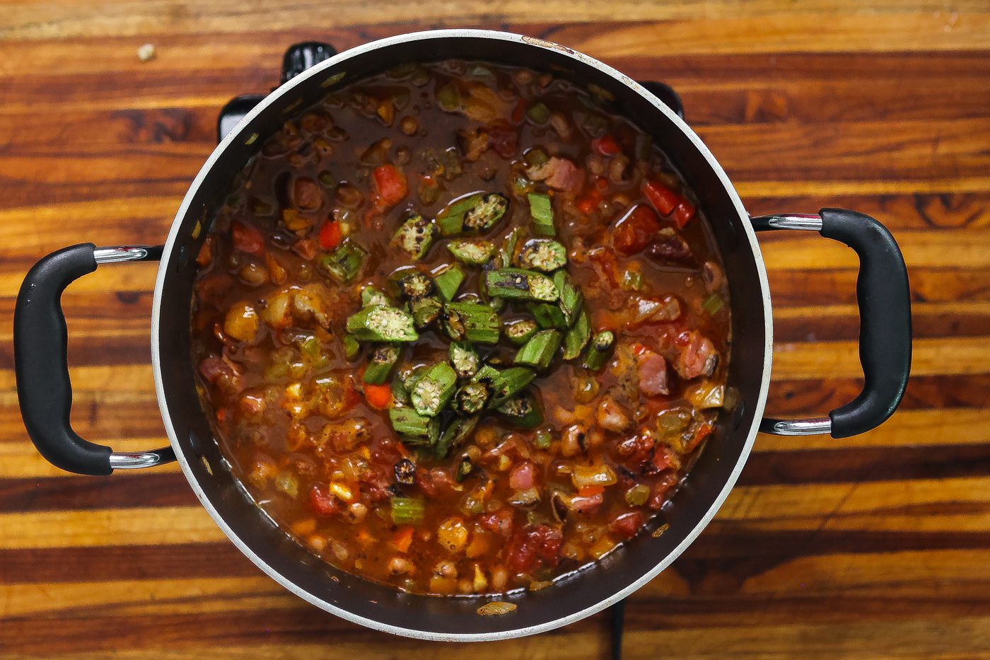 charred okra added to catfish stew