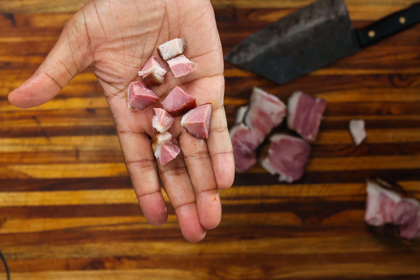 diced ham hocks in hand