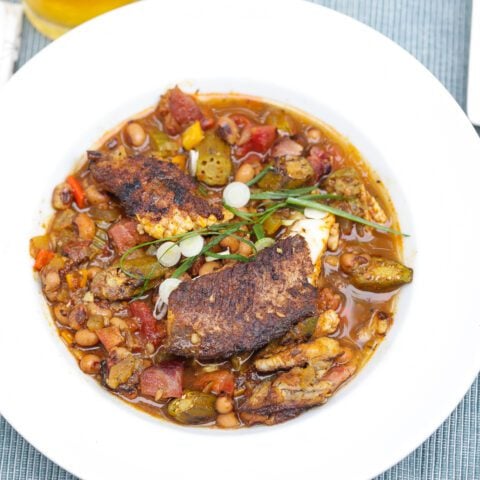 blackened catfish stew with okra and peas in a bowl