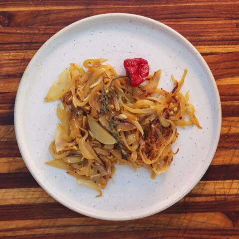 yassa onions on a white plate