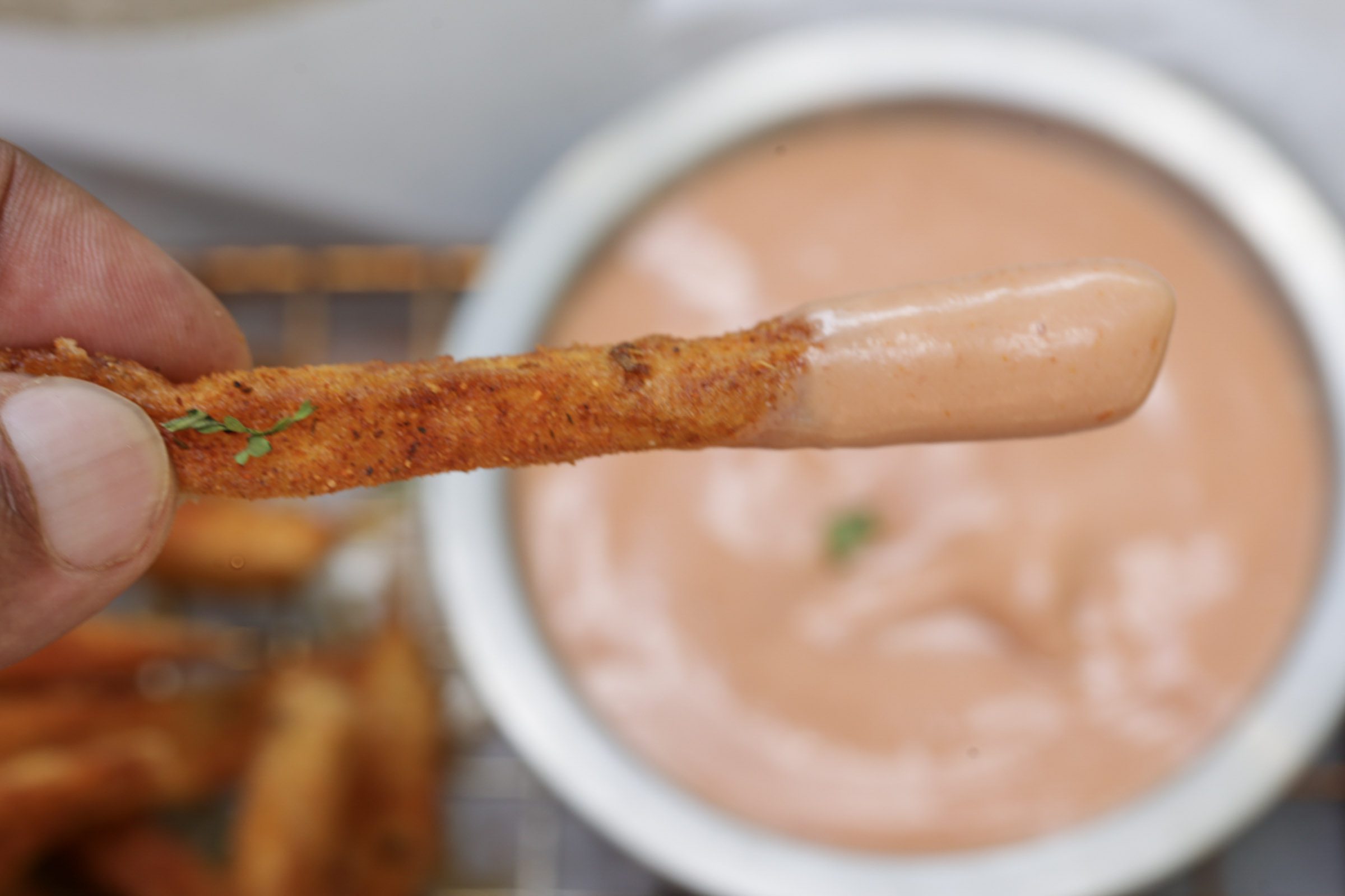 single french fry dipped in sauce