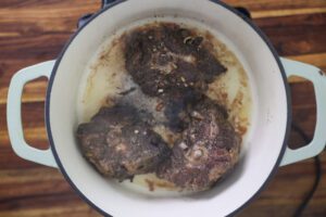 oxtail browning in pan