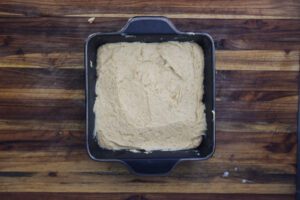 sweet potato cornbread batter in square pan