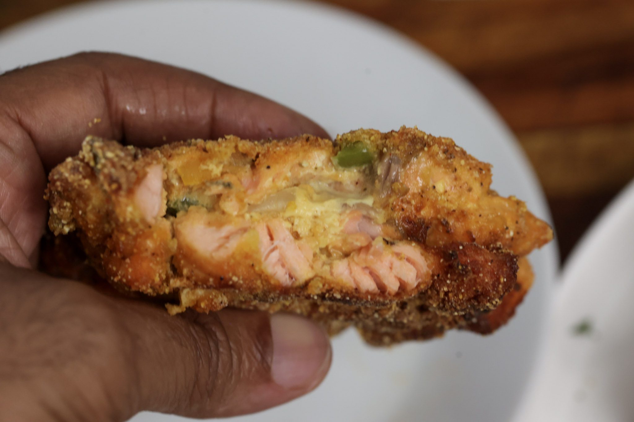 salmon croquette patty in hand